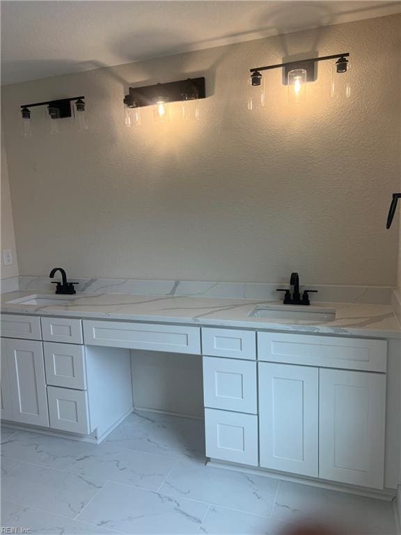 1635 E Bayview Blvd, Norfolk, VA 23503 - full bathroom with marble look tiles, double vanity, and a textured wall