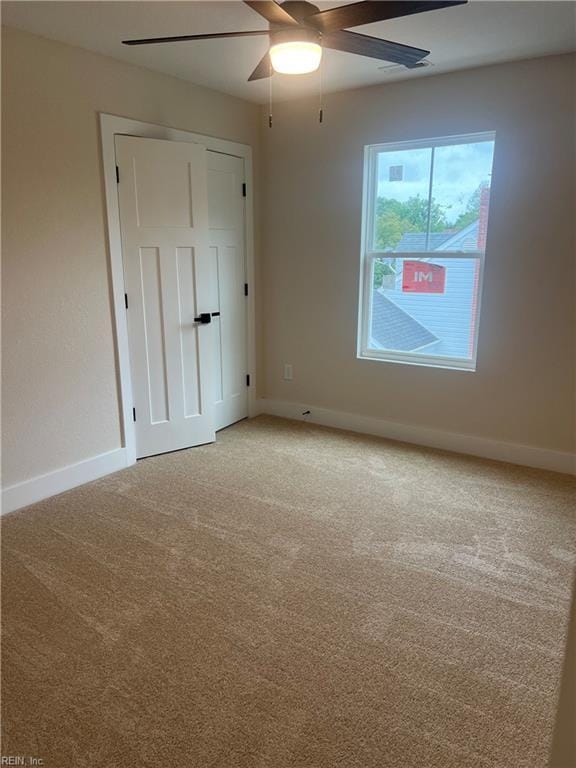 1635 E Bayview Blvd, Norfolk, VA 23503 - spare room featuring a ceiling fan and light colored carpet