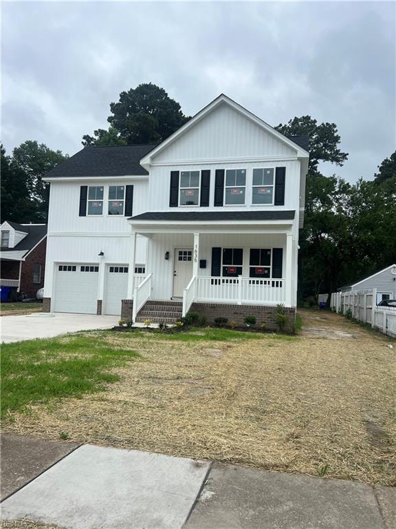 1635 E Bayview Blvd, Norfolk, VA 23503 - view of front facade featuring a garage, covered porch, driveway, and board and batten siding