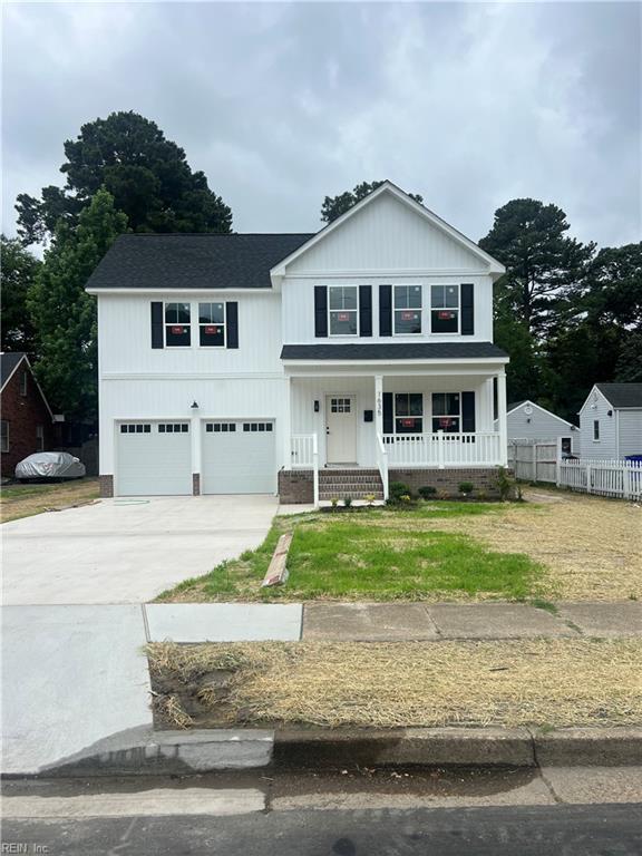 1635 E Bayview Blvd, Norfolk, VA 23503 - view of front of property with an attached garage, a porch, concrete driveway, and roof with shingles