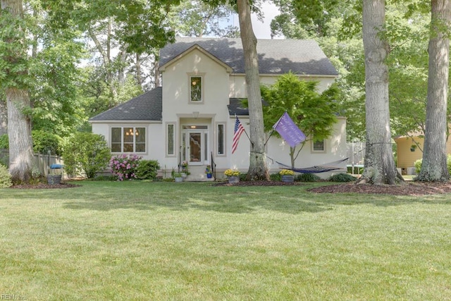 1208 Smith Cove Cir, Virginia Beach, VA 23455 - view of front of house featuring a shingled roof, stucco siding, and a front lawn