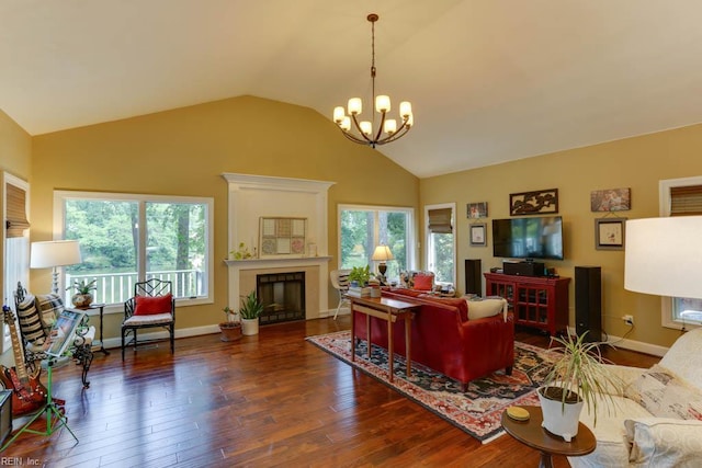 1208 Smith Cove Cir, Virginia Beach, VA 23455 - living room featuring a chandelier, a fireplace, vaulted ceiling, and wood finished floors