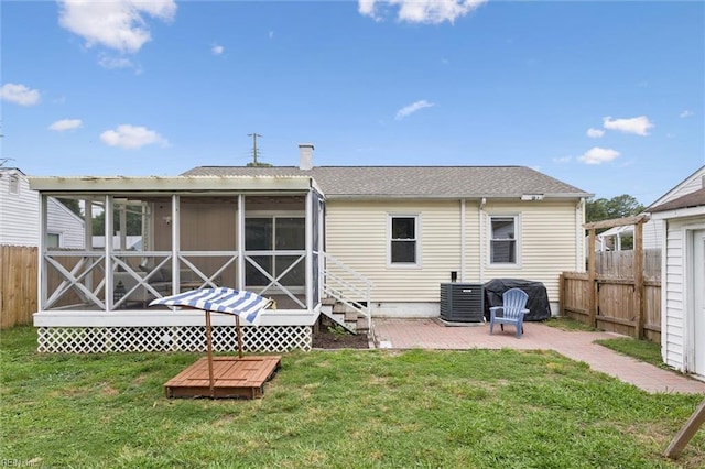 27 Aspenwood Dr, Hampton, VA 23666 - rear view of house with a sunroom, a fenced backyard, a patio area, and a shingled roof