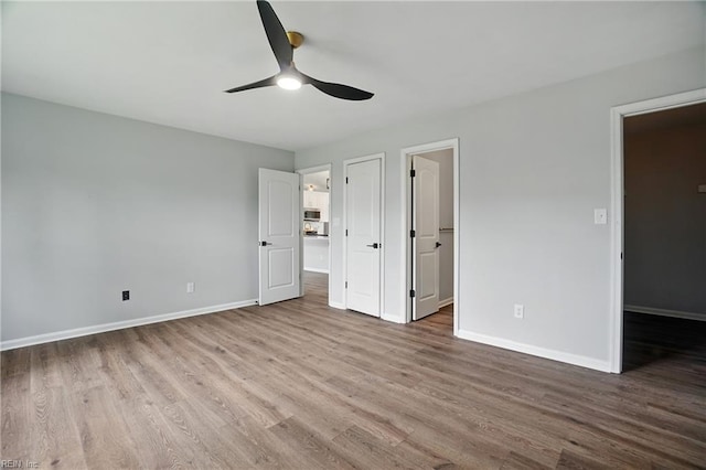 2317 Esplanade Dr, Virginia Beach, VA 23456 - unfurnished bedroom with wood finished floors, a spacious closet, and ceiling fan