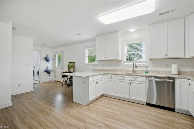 734 Gallbush Rd, Chesapeake, VA 23322 - kitchen with stainless steel dishwasher, washer and dryer, a peninsula, white cabinetry, and crown molding
