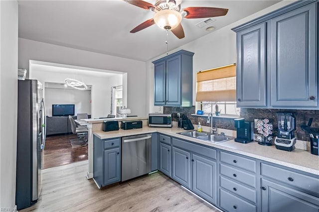 1508 Big Bethel Rd, Hampton, VA 23666 - kitchen with stainless steel appliances, a ceiling fan, a peninsula, and backsplash