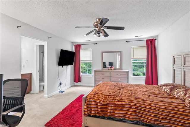 1508 Big Bethel Rd, Hampton, VA 23666 - bedroom featuring carpet floors, multiple windows, a textured ceiling, connected bathroom, and a ceiling fan