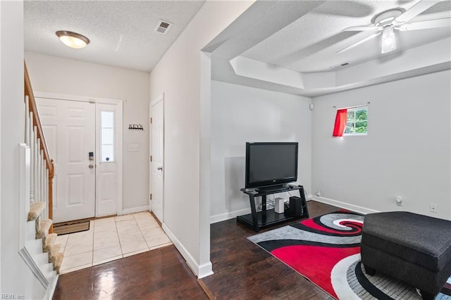 1508 Big Bethel Rd, Hampton, VA 23666 - entrance foyer with a textured ceiling, stairway, a ceiling fan, and wood finished floors