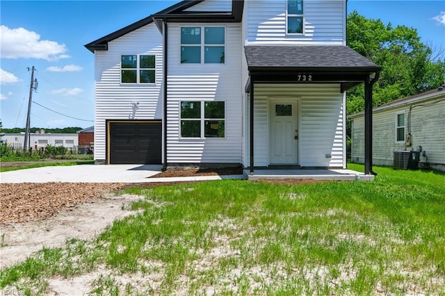 732 Birch Ave, Hampton, VA 23661 - view of front facade with a shingled roof, driveway, a front yard, a garage, and a porch