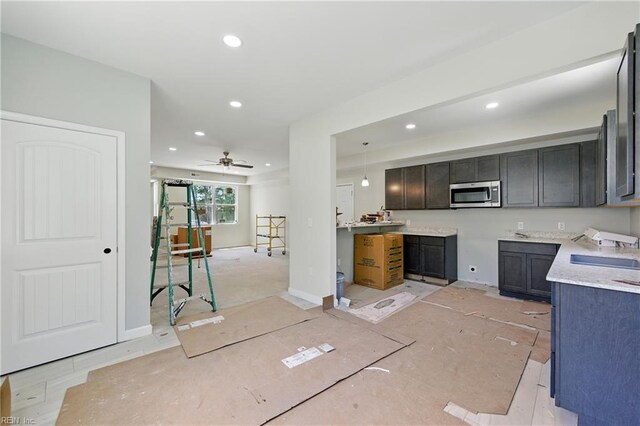 732 Birch Ave, Hampton, VA 23661 - kitchen with stainless steel microwave, recessed lighting, a ceiling fan, and light countertops