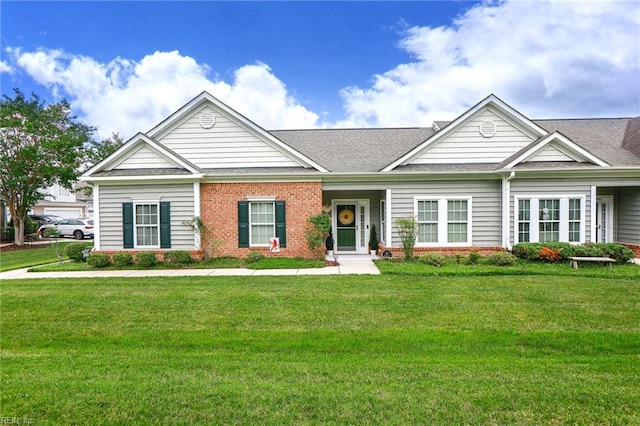 911 Vineyard Pl Unit # C, Suffolk, VA 23435 - view of front of home featuring brick siding, a front lawn, and a shingled roof