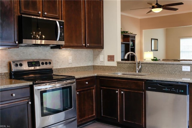 911 Vineyard Pl Unit # C, Suffolk, VA 23435 - kitchen with stainless steel appliances, ornamental molding, a ceiling fan, dark brown cabinetry, and decorative backsplash