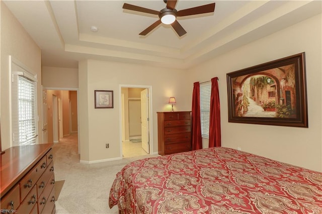 911 Vineyard Pl Unit # C, Suffolk, VA 23435 - bedroom featuring light colored carpet, a tray ceiling, ensuite bathroom, and a ceiling fan