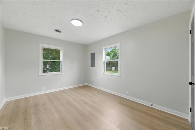 615 Hilton Blvd, Newport News, VA 23605 - unfurnished room with light wood finished floors and a textured ceiling