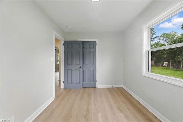 615 Hilton Blvd, Newport News, VA 23605 - unfurnished bedroom featuring light wood-style flooring and arched walkways