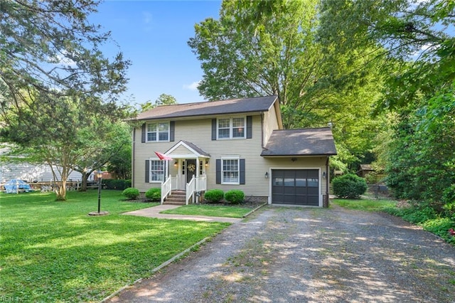 102 Dogwood Dr, Williamsburg, VA 23185 - colonial home featuring driveway, an attached garage, and a front lawn