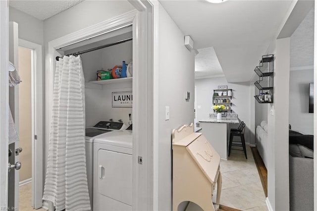 102 Dogwood Dr, Williamsburg, VA 23185 - laundry area featuring washer and dryer and light tile patterned flooring