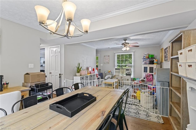 102 Dogwood Dr, Williamsburg, VA 23185 - dining space featuring wood finished floors, a chandelier, ceiling fan, crown molding, and a textured ceiling