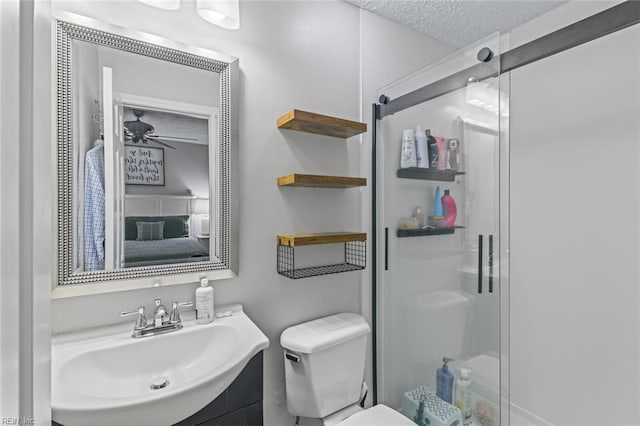102 Dogwood Dr, Williamsburg, VA 23185 - bathroom featuring a shower stall, vanity, a textured ceiling, and a ceiling fan