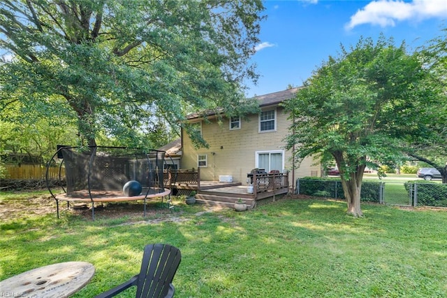 102 Dogwood Dr, Williamsburg, VA 23185 - back of house featuring a trampoline and a wooden deck