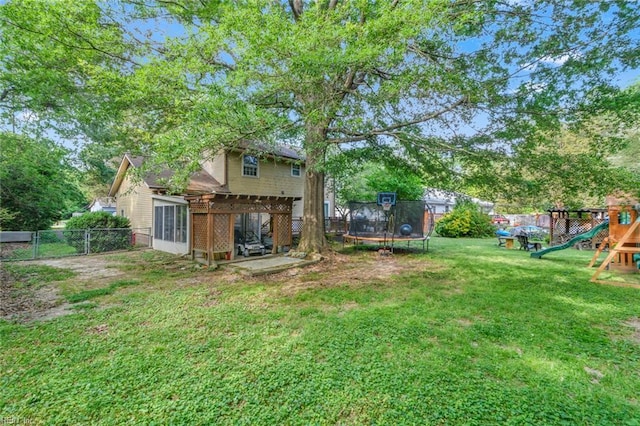 102 Dogwood Dr, Williamsburg, VA 23185 - fenced backyard with a trampoline, a playground, and a patio area