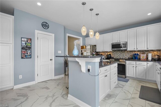 2224 Cabot Ct, Virginia Beach, VA 23456 - kitchen with stainless steel appliances, light marble finish floors, recessed lighting, a kitchen island, and backsplash