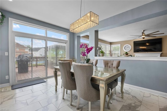 2224 Cabot Ct, Virginia Beach, VA 23456 - dining space with light marble finish flooring, a chandelier, and a ceiling fan