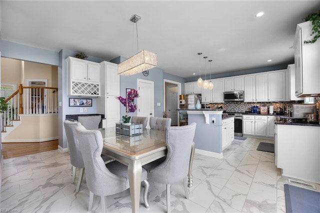 2224 Cabot Ct, Virginia Beach, VA 23456 - dining room featuring light marble finish flooring, recessed lighting, and stairs