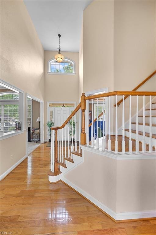 2224 Cabot Ct, Virginia Beach, VA 23456 - foyer entrance with healthy amount of natural light, wood finished floors, a towering ceiling, and stairway