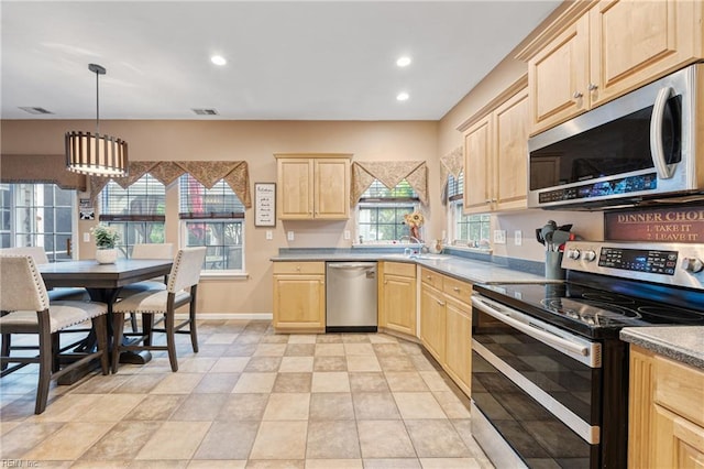 2060 Queens Point Dr, Suffolk, VA 23434 - kitchen with appliances with stainless steel finishes, light brown cabinets, recessed lighting, and hanging light fixtures