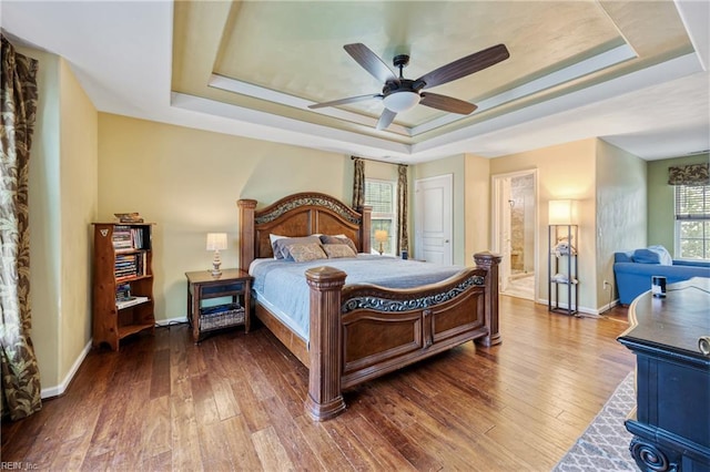 2060 Queens Point Dr, Suffolk, VA 23434 - bedroom with a raised ceiling, wood-type flooring, and a ceiling fan