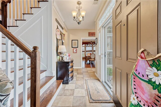 2060 Queens Point Dr, Suffolk, VA 23434 - entrance foyer featuring a chandelier, stairway, healthy amount of natural light, and ornamental molding
