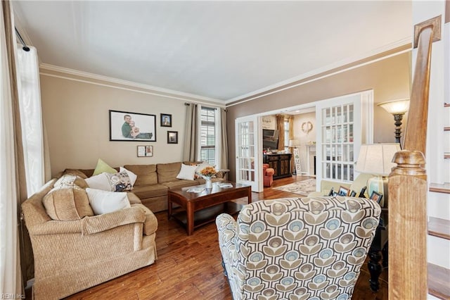 2060 Queens Point Dr, Suffolk, VA 23434 - living room featuring french doors, wood finished floors, and ornamental molding