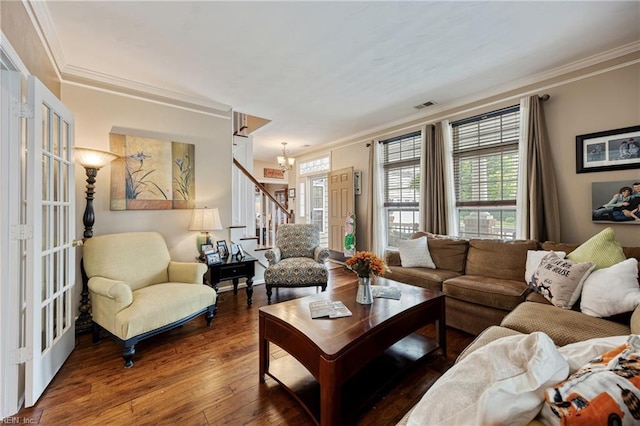 2060 Queens Point Dr, Suffolk, VA 23434 - living room featuring ornamental molding, stairs, plenty of natural light, wood-type flooring, and a chandelier