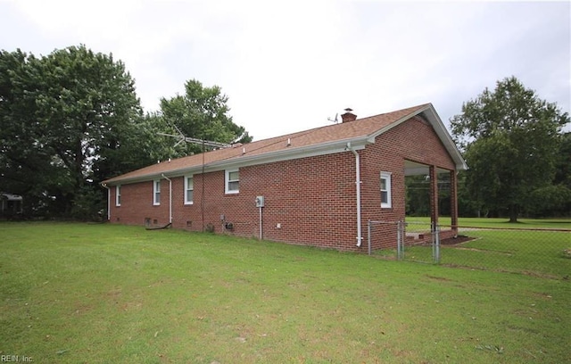 6190 W Blackwater Rd, Zuni, VA 23898 - view of property exterior featuring brick siding and a chimney