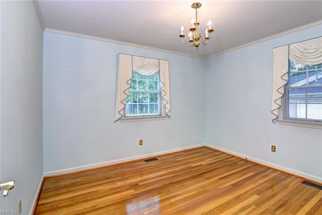 5 Yulee Ct, Hampton, VA 23669 - empty room with plenty of natural light, a chandelier, crown molding, and wood finished floors