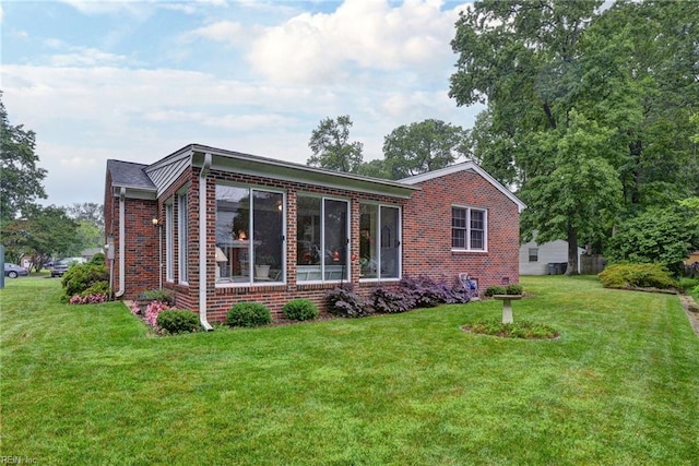 5 Yulee Ct, Hampton, VA 23669 - rear view of property featuring brick siding and a lawn