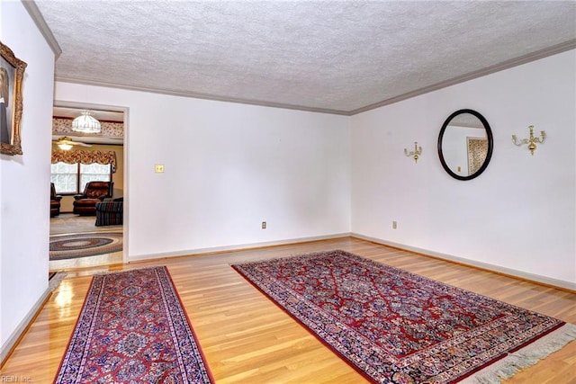 5 Yulee Ct, Hampton, VA 23669 - unfurnished room featuring wood finished floors, crown molding, and a textured ceiling
