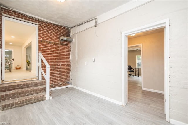 3760 Nansemond Pkwy, Suffolk, VA 23435 - unfurnished room featuring wood finished floors and brick wall
