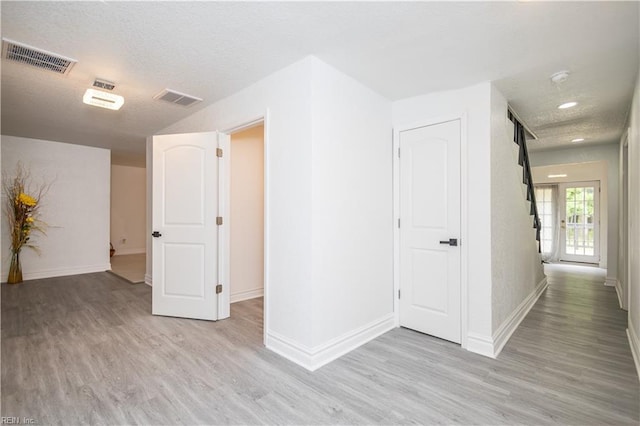 3760 Nansemond Pkwy, Suffolk, VA 23435 - corridor with light wood-style floors and a textured ceiling
