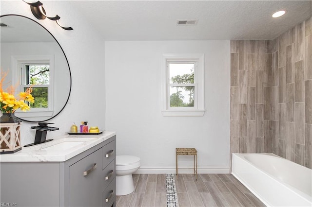 3760 Nansemond Pkwy, Suffolk, VA 23435 - full bathroom with vanity, recessed lighting, bathing tub / shower combination, and wood finish floors