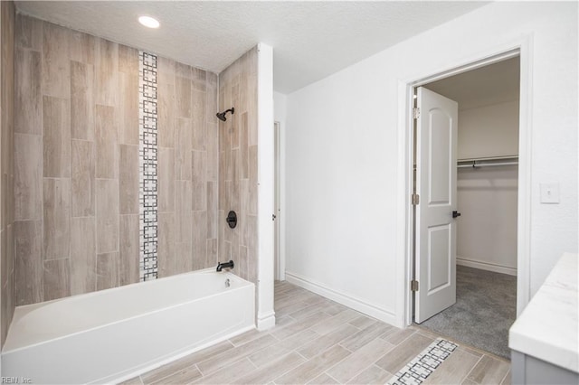 3760 Nansemond Pkwy, Suffolk, VA 23435 - bathroom featuring shower / bath combination, vanity, a spacious closet, recessed lighting, and wood finished floors