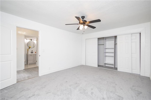 3760 Nansemond Pkwy, Suffolk, VA 23435 - unfurnished bedroom with carpet flooring, a closet, a ceiling fan, and a textured ceiling