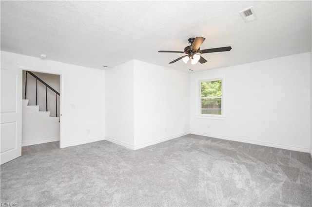 3760 Nansemond Pkwy, Suffolk, VA 23435 - empty room featuring carpet, ceiling fan, stairway, and a textured ceiling