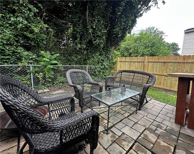 154 Tynes St, Suffolk, VA 23434 - fenced backyard with a patio