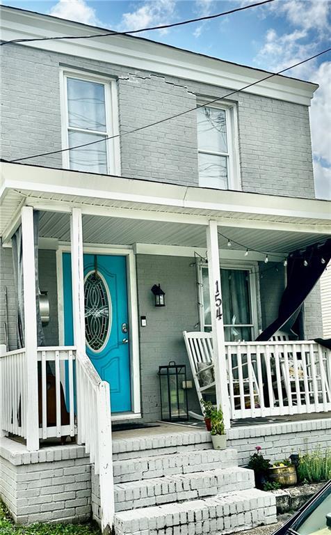 154 Tynes St, Suffolk, VA 23434 - view of front of property featuring brick siding and covered porch