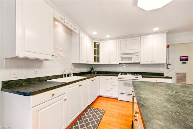 1904 Sandee Cres, Virginia Beach, VA 23454 - kitchen featuring white appliances, dark countertops, white cabinets, recessed lighting, and glass insert cabinets
