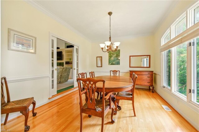 1904 Sandee Cres, Virginia Beach, VA 23454 - dining space with crown molding, light wood-style floors, and a chandelier