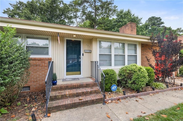 701 Milton Dr, Hampton, VA 23666 - entrance to property featuring a chimney, brick siding, and board and batten siding