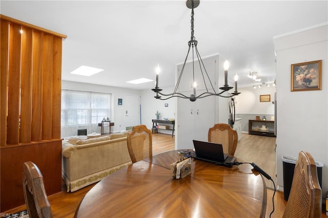 701 Milton Dr, Hampton, VA 23666 - dining room featuring a skylight, a chandelier, and wood finished floors